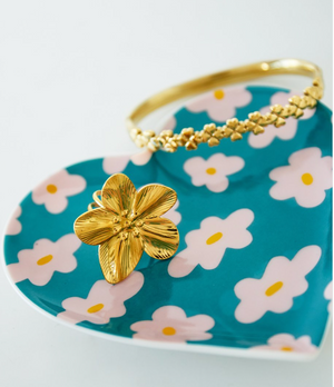 Heart shaped trinket tray with teal background and pink flowers
