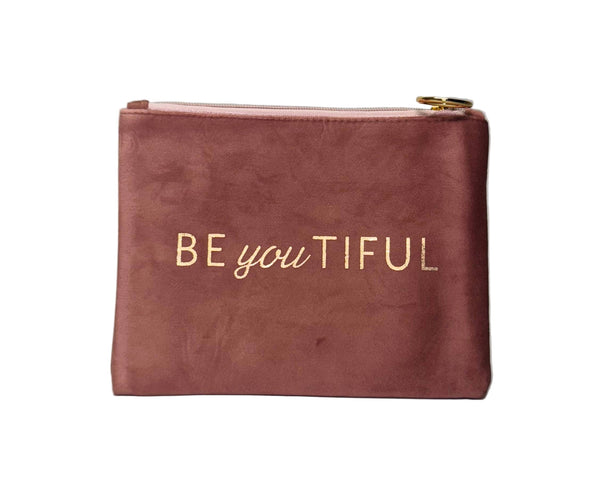 Pink pouch with 'BE you TIFUL' text on a gray background