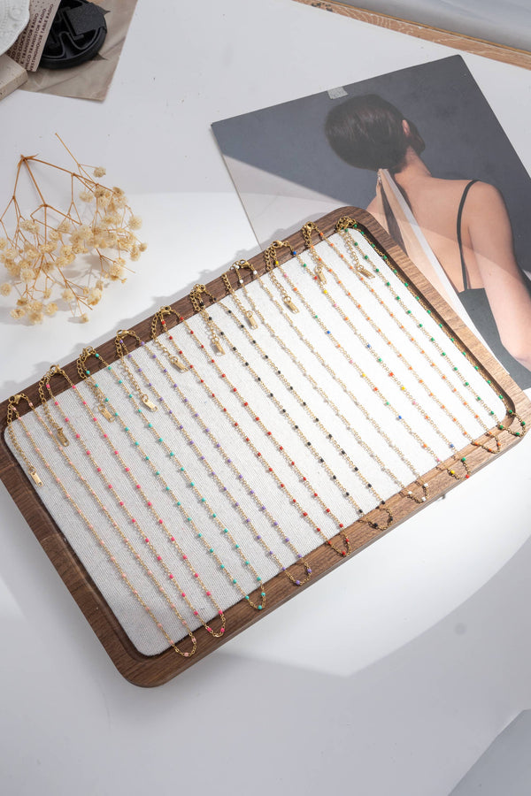Set of 10 gold necklaces with colored fine pearls — elegant women's