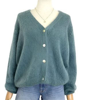 Teal mohair cardigan on a mannequin with a plain background