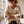 Load image into Gallery viewer, A chunky knit, textured cream sweater with three-quarter sleeves and dark embroidered star details on the cuffs.
