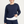 Load image into Gallery viewer, Woman wearing a navy blue sweatshirt and pants on a light gray background
