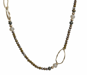 Beaded necklace in golden tones with brushed gold loops.