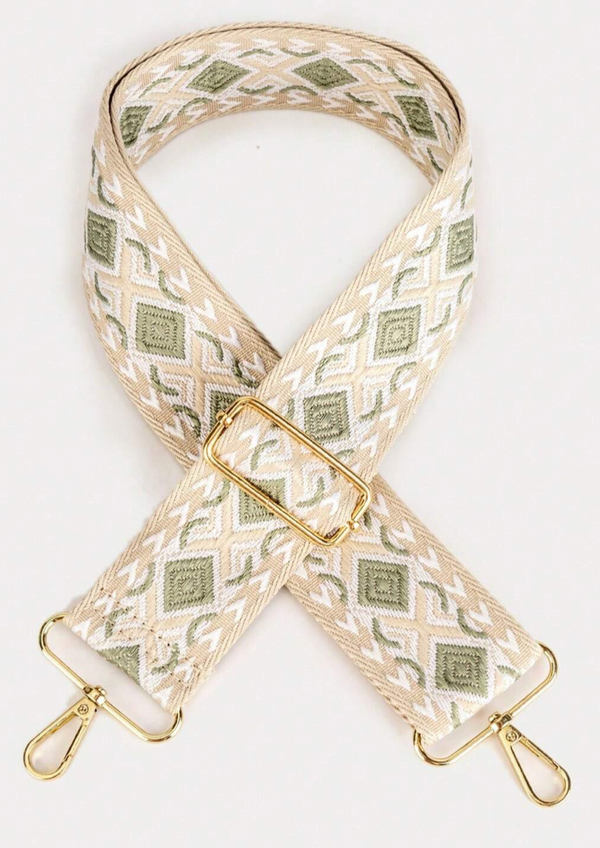 Green and white woven bag strap