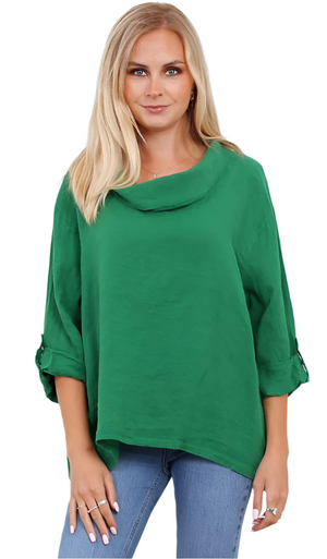 Woman wearing a Kelly Green linen top with a cowl neck