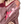 Load image into Gallery viewer, Close-up of a person wearing a patterned sweater with floral embroidered designs on a plain background
