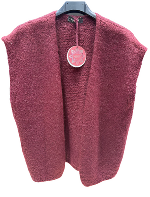 Maroon knitted vest on a hanger with a brand tag against a black background