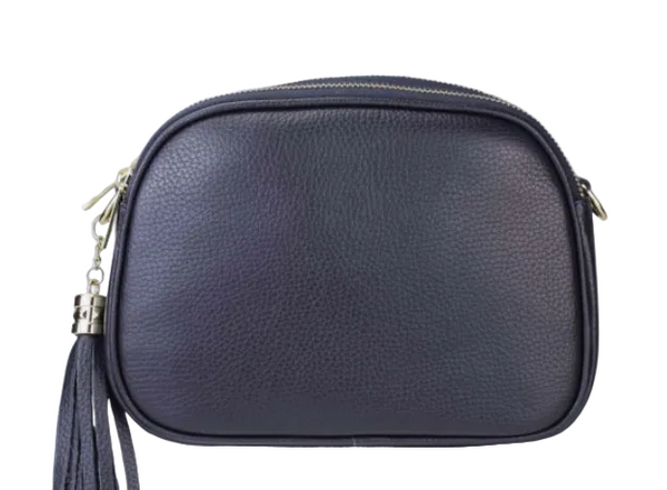 Navy blue handbag with a tassel on a light gray background