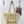 Load image into Gallery viewer, Beige crochet bag with a plain background
