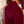 Load image into Gallery viewer, Close-up of a woman wearing a burgundy ribbed knit zip-up sweater with a white stripe down the sleeve, over a white top.

