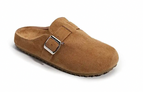 A single tan suede clog-style mule shoe with a silver buckle strap, shown from a three-quarters angle on a white background.