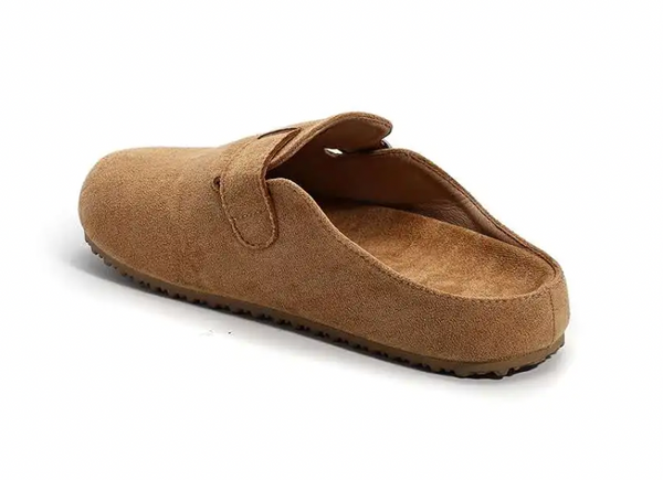 A single tan suede clog slipper shown from a three-quarters angle on a white background.