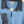 Load image into Gallery viewer, A light blue knit zip-up sweater with a denim collar and a denim chest pocket, hanging on a wooden hanger. The brand name 'LIZABELLE' is visible on the neck label.
