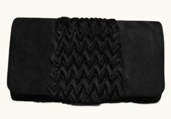 A black clutch bag featuring a wide, vertically pleated chevron-textured center panel flanked by smoother matte side panels, shown against a plain off-white background.