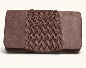 A brown suede clutch bag featuring a central chevron-patterned flap, photographed against a clean off-white background.