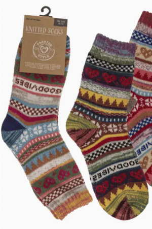 Colorful knitted socks with a pattern on a white background