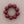 Load image into Gallery viewer, A beaded bracelet made of matte, dark red-brown round beads arranged in a circle on a neutral beige background.
