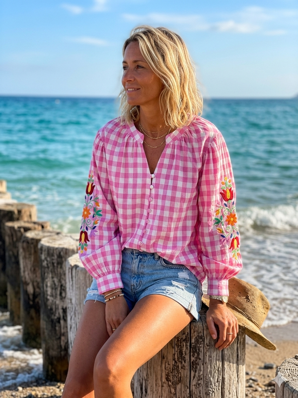 Checked tunic with floral embroidery on the sleeves