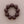 Load image into Gallery viewer, A dark brown beaded bracelet with large, smooth round beads and a small gold clasp, displayed on a neutral beige textured background.
