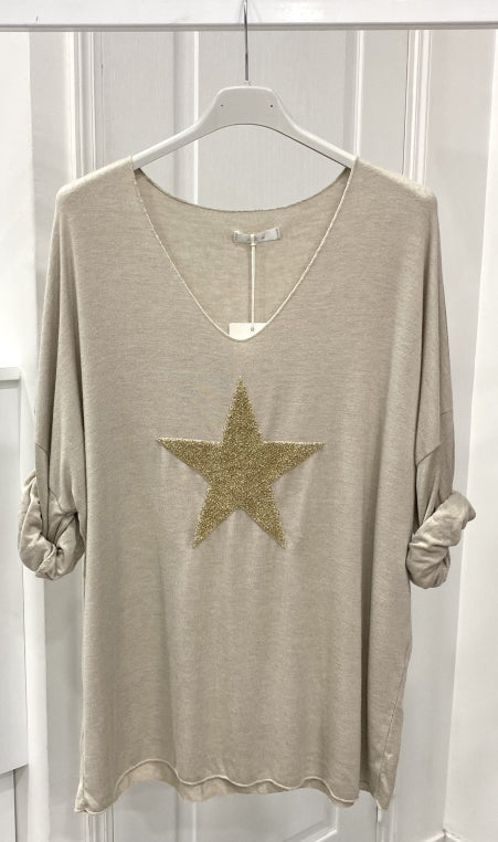 Light sweater embroidered with golden star