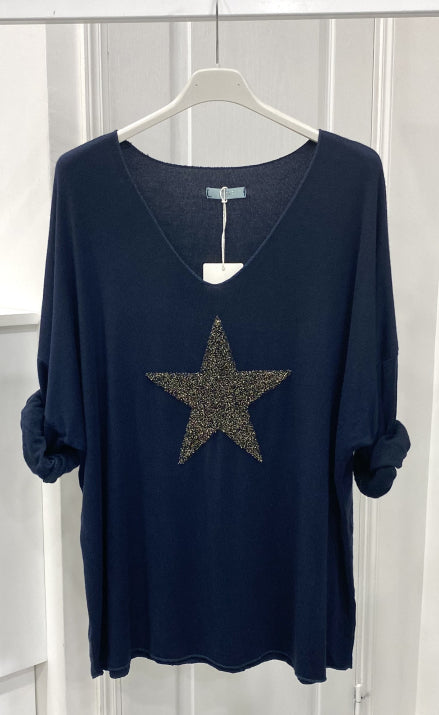 Light sweater embroidered with golden star