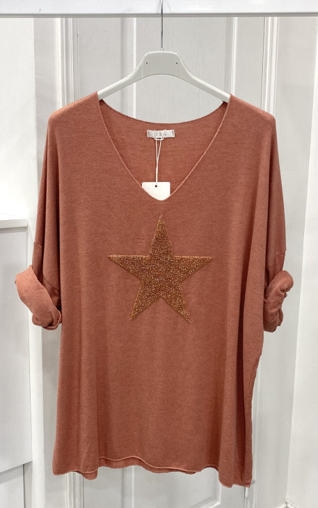 Light sweater embroidered with golden star